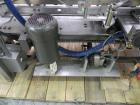 Used Tisma (SWF) VT-100-RH Vertical Cartoner with glue flap closures. Capable of speeds up to 200 cartons per minute. Unit has 7.5