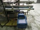 Used Tisma (SWF) VT-100-RH Vertical Cartoner with glue flap closures. Capable of speeds up to 200 cartons per minute. Unit has 7.5