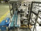 Used Tisma (SWF) VT-100-RH Vertical Cartoner with glue flap closures. Capable of speeds up to 200 cartons per minute. Unit has 7.5
