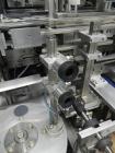 Used Tisma (SWF) VT-100-RH Vertical Cartoner with glue flap closures. Capable of speeds up to 200 cartons per minute. Unit has 7.5