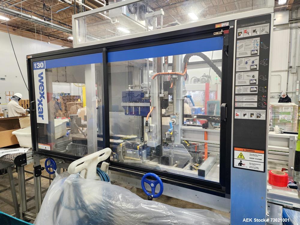 Used Wexxar Automatic Case Erector Sealer, Model WF-30. Machine is capable of speeds up to 30 cases per minute (depending on case size). Pin and dome-style opening. Nordson hot melt glue unit. Has a ...