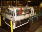 Used SWF Mcdowell 201LH case erector and bottom sealer capable of speeds up to 30 cases per minute. Has Nordson 3400 glue system and a case size range: length 7