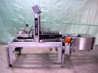 Used Belcor 505 semi-automatic case erector with integrated Belcor 252 automatic top and bottom case taper sealer. Speeds up to 15 cpm. Erector size range: length 8