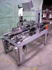 Used Belcor 505 semi-automatic case erector with integrated Belcor 252 automatic top and bottom case taper sealer. Speeds up to 15 cpm. Erector size range: length 8