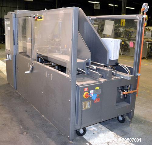 Used Wepackit Model 310E Mid-Speed Case Erector. Capable of up to 15 cases per minute. Approximate case size range:length 6’’ to 24’’, width 5.5’’ to 18", depth 4.5’’ to 20’’.Maximum knock-down lengt...