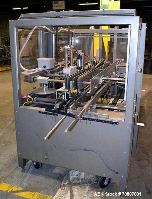 Used Wepackit Model 310E Mid-Speed Case Erector. Capable of up to 15 cases per minute. Approximate case size range:length 6’’ to 24’’, width 5.5’’ to 18", depth 4.5’’ to 20’’.Maximum knock-down lengt...