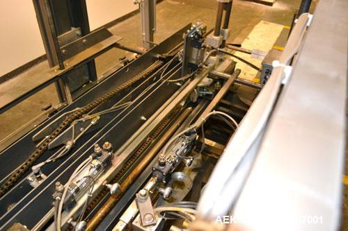 Used Wepackit Model 310E Mid-Speed Case Erector. Capable of up to 15 cases per minute. Approximate case size range:length 6’’ to 24’’, width 5.5’’ to 18", depth 4.5’’ to 20’’.Maximum knock-down lengt...