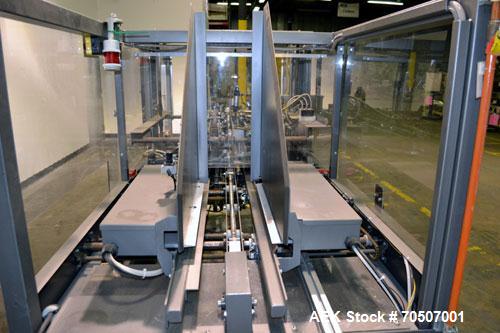 Used Wepackit Model 310E Mid-Speed Case Erector. Capable of up to 15 cases per minute. Approximate case size range:length 6’’ to 24’’, width 5.5’’ to 18", depth 4.5’’ to 20’’.Maximum knock-down lengt...