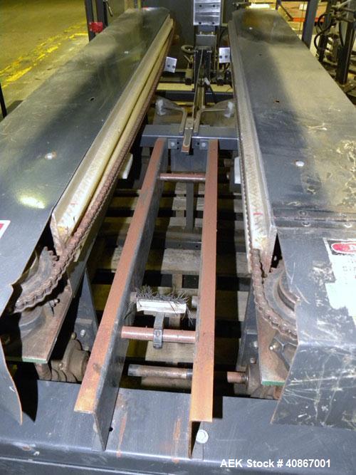 Used Loveshaw Little David Case Former, Model CF40T, Carbon Steel. Approximately 20 cases per minute. Case size range: length 7" to 24", width 6" to 16", height 4" to 16". Chain and lug drive, 1/2 hp...