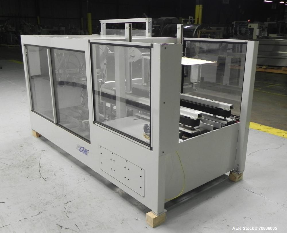 Used OK International Model Duraformer 2 Automatic Case Erector and Bottom Taper. Machine is capable of speeds up to 18 cases per minute. Case size range: (Length) 7" - 20" (Width) 6" - 16" (Height) ...