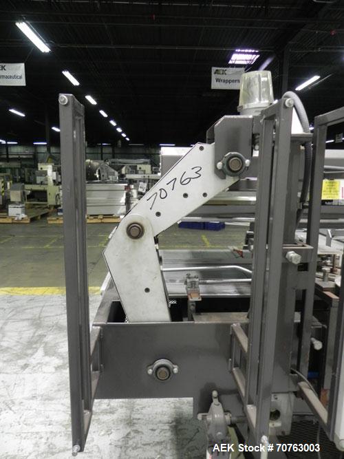 Used Hartness (SWF/McDowell) Model 201LH Automatic Case Erector Bottom Sealer. Capable of speeds up to 30 cases per minute. Has a case size range: (Length) 5-3/4" - 24" (Width) 5-3/4" - 24" (Depth) 1...