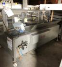 Used Combi Model 2EZ Case Erector Sealer.