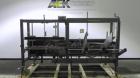 Used Combi Model 2-EZ Plus Case Erector and Bottom Taper. Capable of speeds up to 12 cases per minute. Case size range: length 6