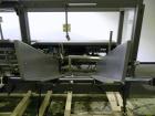 Used Combi Model 2-EZ Plus Case Erector and Bottom Taper. Capable of speeds up to 12 cases per minute. Case size range: length 6