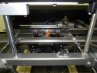 Used Combi Model 2-EZ Plus Case Erector and Bottom Taper. Capable of speeds up to 12 cases per minute. Case size range: length 6