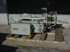 Used Marq model 2000 case erector with bottom taper for sealer forRSC cases. Unit has a size range of 6-14