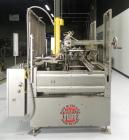 Used Marq Model HPE-RH NS Case Erector Bottom Sealer. Capable of speeds from 30 to 40 cases per minute. Is set up to tape boxes closed (with a side seal). Has a formed case size range: Length 10