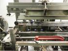 Used Marq Model HPE-RH NS Case Erector Bottom Sealer. Capable of speeds from 30 to 40 cases per minute. Is set up to tape boxes closed (with a side seal). Has a formed case size range: Length 10