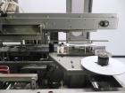 Used Marq Model HPE-RH NS Case Erector Bottom Sealer. Capable of speeds from 30 to 40 cases per minute. Is set up to tape boxes closed (with a side seal). Has a formed case size range: Length 10