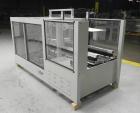 Used OK International Model Duraformer 2 Automatic Case Erector and Bottom Taper. Machine is capable of speeds up to 18 cases per minute. Case size range: (Length) 7