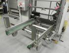 Used OK International Model Duraformer 2 Automatic Case Erector and Bottom Taper. Machine is capable of speeds up to 18 cases per minute. Case size range: (Length) 7