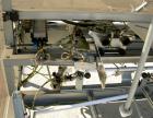 Used Soco Case Erector, Model BE-300-ABS2. Capable of speeds up to 8 cpm. Has bottom tape sealer. Case size range: length 300 to 620 mm, width 200 to 400 mm, depth 130 to 500 mm. Includes an Allen Br...