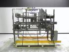 Used Wepackit Model MPE300 Case Erector Bottom Tape Sealer. Machine is capable of speeds up to 20 cases per minute. Knockdown case size range: 16