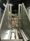 Used Wepackit Model MPE300 Case Erector Bottom Tape Sealer. Machine is capable of speeds up to 20 cases per minute. Knockdown case size range: 16