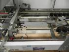 Used Wexxar Silver Series Model 615T Automatic Case Erector and Bottom Sealer. Capable of speeds up to 25 cases per minute. Has pin and dome technology. Case Size range Blank Width: 16