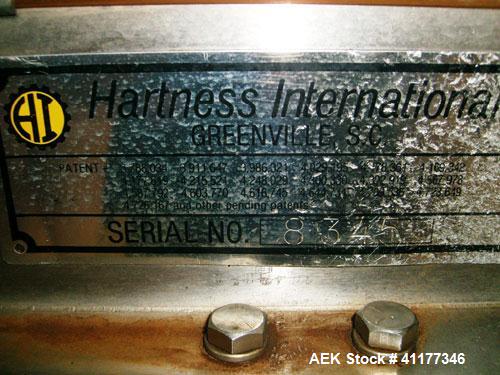 Used Hartness International 825SS drop case packer. Capable of speeds up to 25 CPM. Case size range: length 7" to 22.5", width 5.5" to 16.5", height 2"  to 20".  All stainless steel construction. Has...
