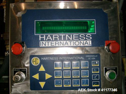 Used Hartness International 825SS drop case packer. Capable of speeds up to 25 CPM. Case size range: length 7" to 22.5", width 5.5" to 16.5", height 2"  to 20".  All stainless steel construction. Has...