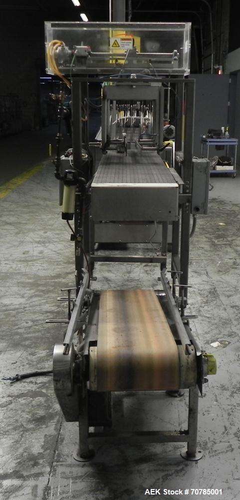 Used Combi Packaging Systems Model DPI Drop Case Packer. Has a model 2LD128 laner option. Capable of speeds up to 28 cases per minute. Has a case size range: (length) 4.5" - 24" (width) 4.5" - 16" (h...