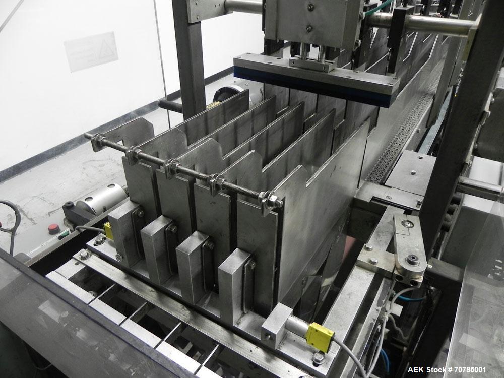 Used Combi Packaging Systems Model DPI Drop Case Packer. Has a model 2LD128 laner option. Capable of speeds up to 28 cases per minute. Has a case size range: (length) 4.5" - 24" (width) 4.5" - 16" (h...