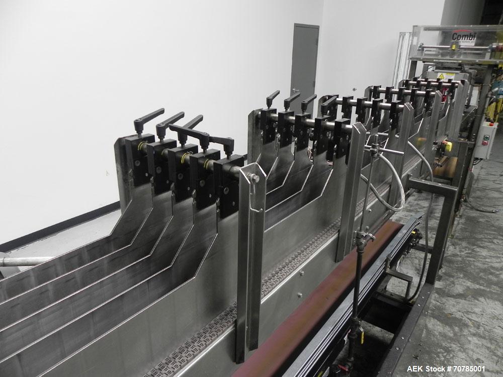 Used Combi Packaging Systems Model DPI Drop Case Packer. Has a model 2LD128 laner option. Capable of speeds up to 28 cases per minute. Has a case size range: (length) 4.5" - 24" (width) 4.5" - 16" (h...