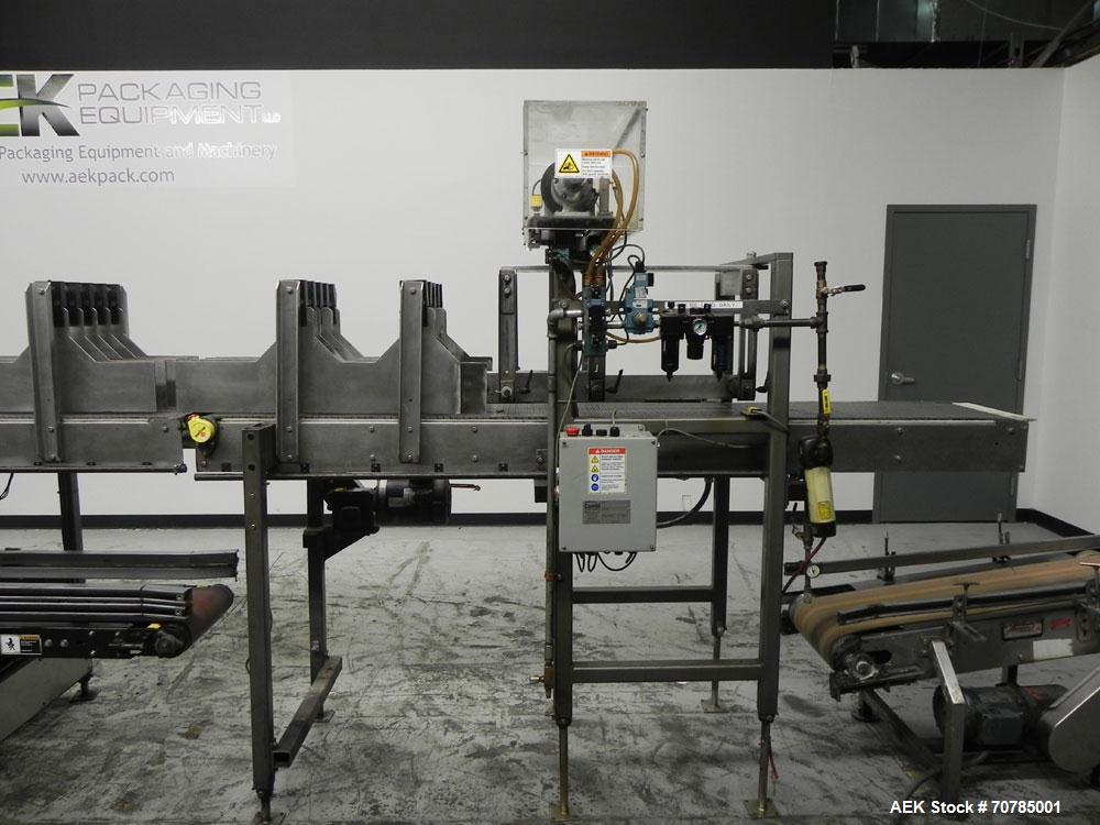 Used Combi Packaging Systems Model DPI Drop Case Packer. Has a model 2LD128 laner option. Capable of speeds up to 28 cases per minute. Has a case size range: (length) 4.5" - 24" (width) 4.5" - 16" (h...