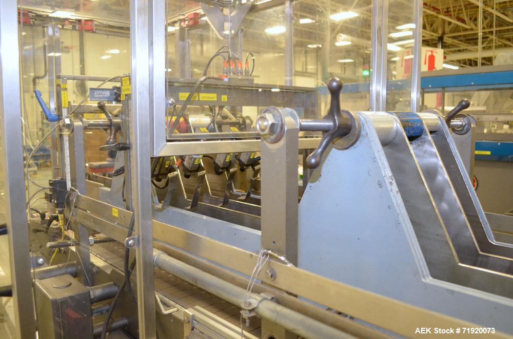 Used Hamrick drop packer, Model Divider, Serial # 91-767. Currently set up for 3-lane operation. 3/60/460V.