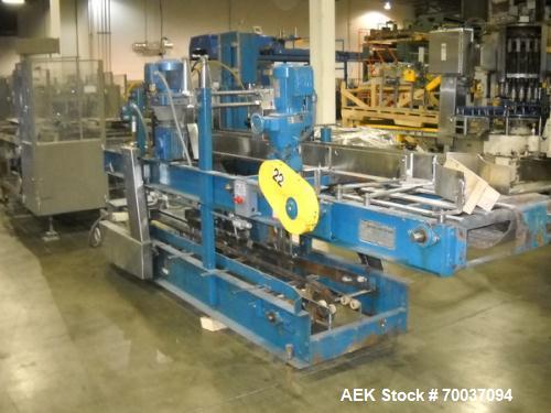 Used Hartness Drop Case Packer, Model 100 RH. Mild steel frame drop casepacker. Includes grid for approximately 0.5L bottle in 4 x 6 pattern. Other grids are available at an additional cost.