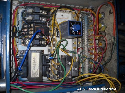Used Hartness Drop Case Packer, Model 100 RH. Mild steel frame drop casepacker. Includes grid for approximately 0.5L bottle in 4 x 6 pattern. Other grids are available at an additional cost.