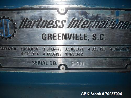 Used Hartness Drop Case Packer, Model 100 RH. Mild steel frame drop casepacker. Includes grid for approximately 0.5L bottle in 4 x 6 pattern. Other grids are available at an additional cost.
