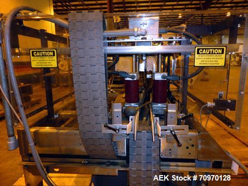 Used Hartness 825-AT automatic stainless steel drop case packer case packer capable of speeds up to 35 cases per minute (depending on product and application). Case size range: (Length) 6" - 24" (Wid...