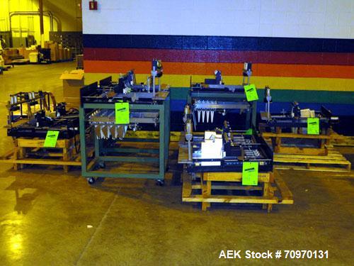 Used Hartness International 825AT Case Packer Change Parts. Consisting Of: 3 skids, 3 carts. 580cc (12pk), 1875cc (6pk.), 850cc (6pk.), 1250cc (6pk.), 1875cc (8pk.), 850cc (12pk.), 5.5 oz. (12pk.), 1...