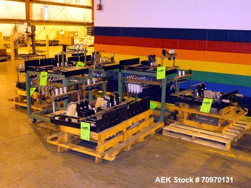 Used Hartness International 825AT Case Packer Change Parts. Consisting Of: 3 skids, 3 carts. 580cc (12pk), 1875cc (6pk.), 850cc (6pk.), 1250cc (6pk.), 1875cc (8pk.), 850cc (12pk.), 5.5 oz. (12pk.), 1...