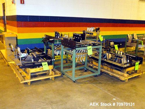 Used Hartness International 825AT Case Packer Change Parts. Consisting Of: 3 skids, 3 carts. 580cc (12pk), 1875cc (6pk.), 850cc (6pk.), 1250cc (6pk.), 1875cc (8pk.), 850cc (12pk.), 5.5 oz. (12pk.), 1...