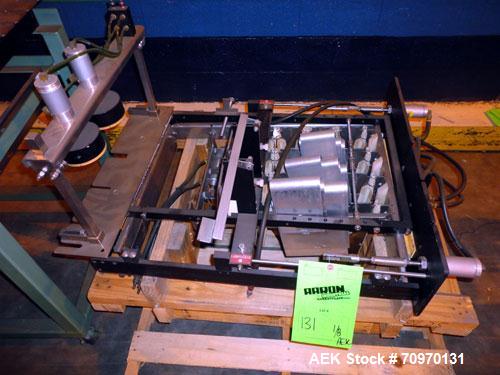 Used Hartness International 825AT Case Packer Change Parts. Consisting Of: 3 skids, 3 carts. 580cc (12pk), 1875cc (6pk.), 850cc (6pk.), 1250cc (6pk.), 1875cc (8pk.), 850cc (12pk.), 5.5 oz. (12pk.), 1...