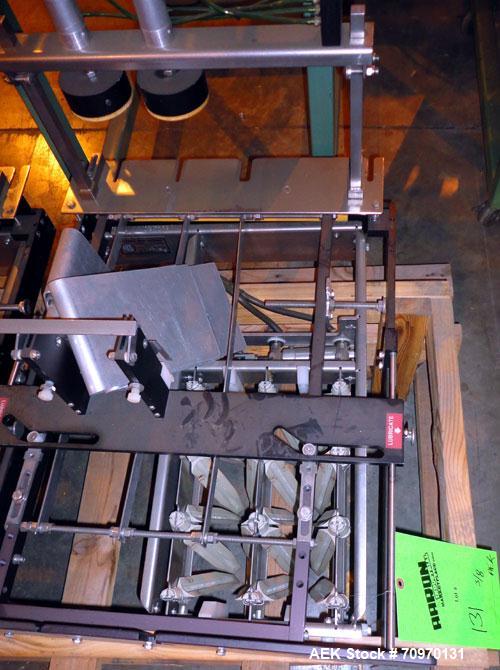 Used Hartness International 825AT Case Packer Change Parts. Consisting Of: 3 skids, 3 carts. 580cc (12pk), 1875cc (6pk.), 850cc (6pk.), 1250cc (6pk.), 1875cc (8pk.), 850cc (12pk.), 5.5 oz. (12pk.), 1...