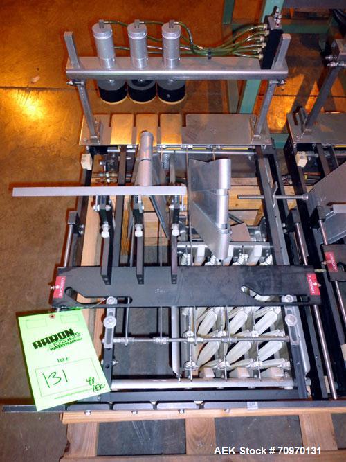 Used Hartness International 825AT Case Packer Change Parts. Consisting Of: 3 skids, 3 carts. 580cc (12pk), 1875cc (6pk.), 850cc (6pk.), 1250cc (6pk.), 1875cc (8pk.), 850cc (12pk.), 5.5 oz. (12pk.), 1...