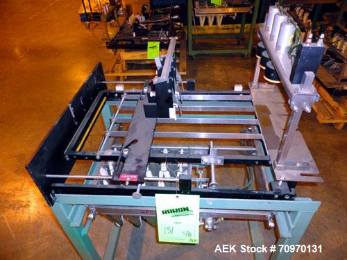 Used Hartness International 825AT Case Packer Change Parts. Consisting Of: 3 skids, 3 carts. 580cc (12pk), 1875cc (6pk.), 850cc (6pk.), 1250cc (6pk.), 1875cc (8pk.), 850cc (12pk.), 5.5 oz. (12pk.), 1...