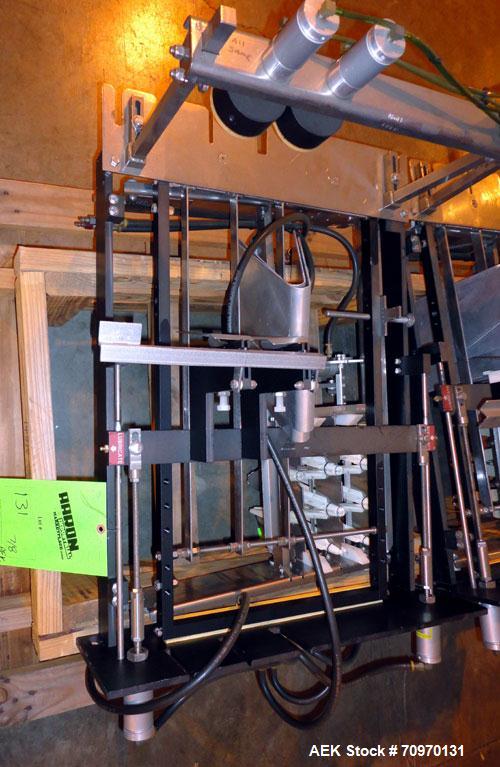 Used Hartness International 825AT Case Packer Change Parts. Consisting Of: 3 skids, 3 carts. 580cc (12pk), 1875cc (6pk.), 850cc (6pk.), 1250cc (6pk.), 1875cc (8pk.), 850cc (12pk.), 5.5 oz. (12pk.), 1...