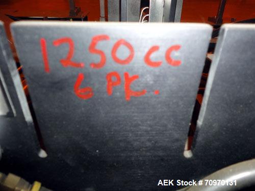 Used Hartness International 825AT Case Packer Change Parts. Consisting Of: 3 skids, 3 carts. 580cc (12pk), 1875cc (6pk.), 850cc (6pk.), 1250cc (6pk.), 1875cc (8pk.), 850cc (12pk.), 5.5 oz. (12pk.), 1...