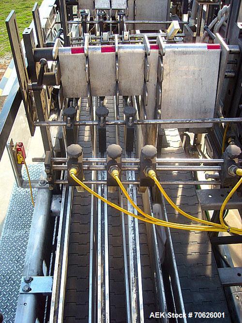 Used Hartness Model 825 Fully Auto Case Packer with all stainless steel frame.Unit has been recently upgraded from factory with Parker drives for auto-laner.Panel is complete with AB 503 PLC controll...